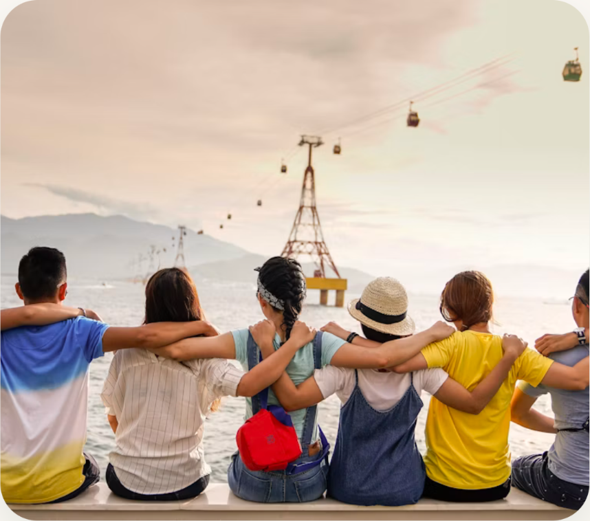 Community members sitting together by the water